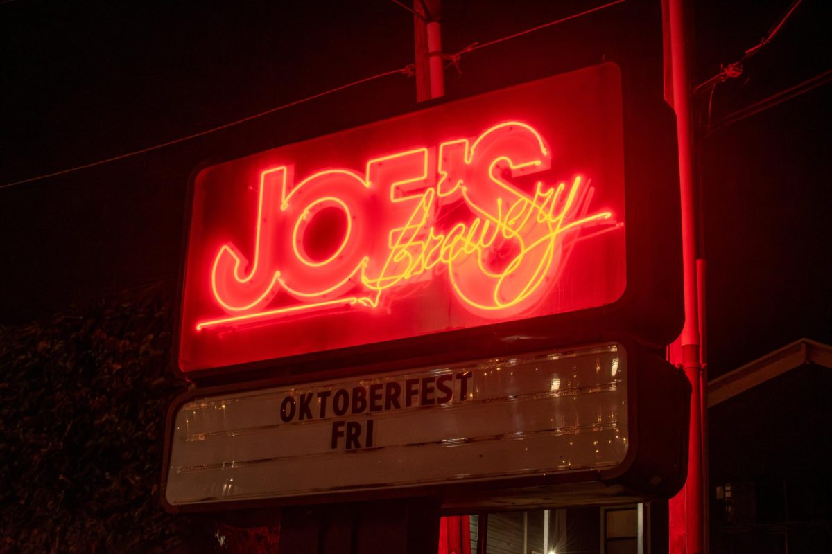 The iconic red neon sign of Joes Brewery.