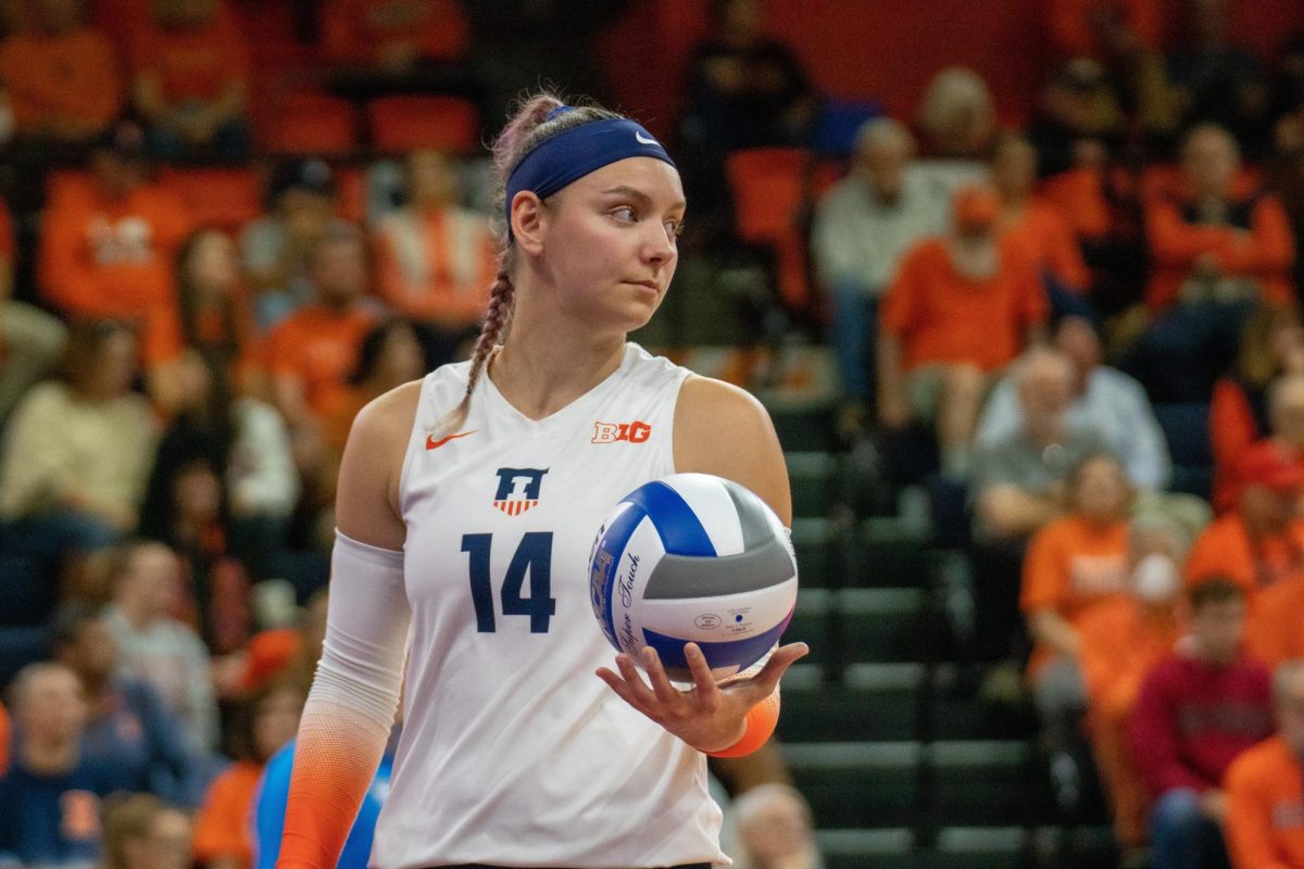 Fifth year outside hitter Jessica Nunge prepares to serve the ball against Indiana on Oct. 25.