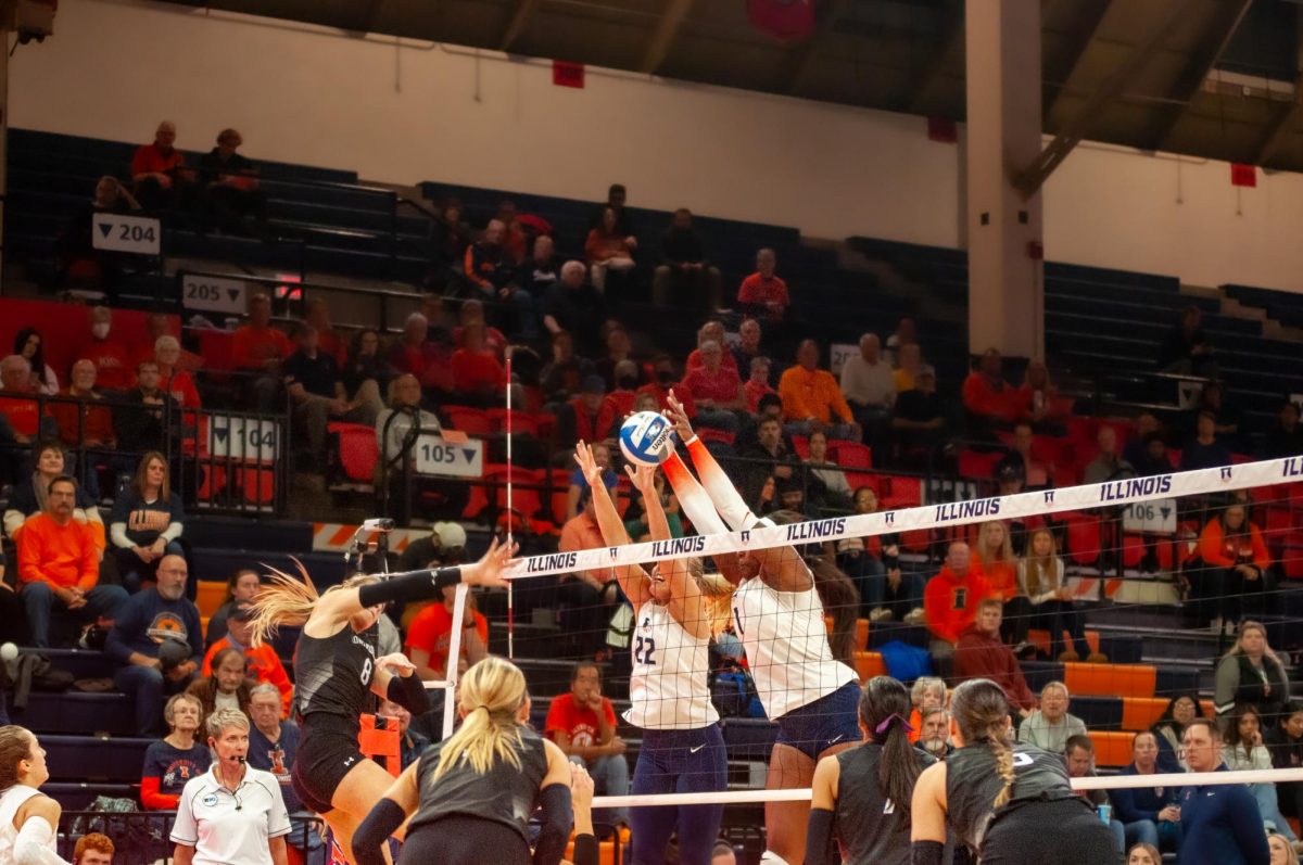 Kennedy Collins and Brooke Mosher block a Northwestern dig at Huff Hall on Nov. 1..
