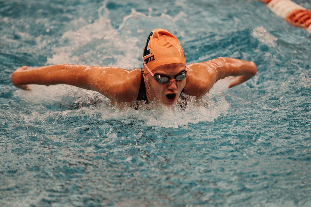Senior Sophia Burwitz swims the 100 yard butterfly during the meet aginst Vanderbilt yesterday. 