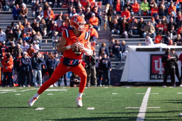 Quarterback John Paddock looks to pass in the first quarter of the Illini football game against the Hoosiers. The game ended up going into overtime after a 42-42 tie game at the end of regulation.
