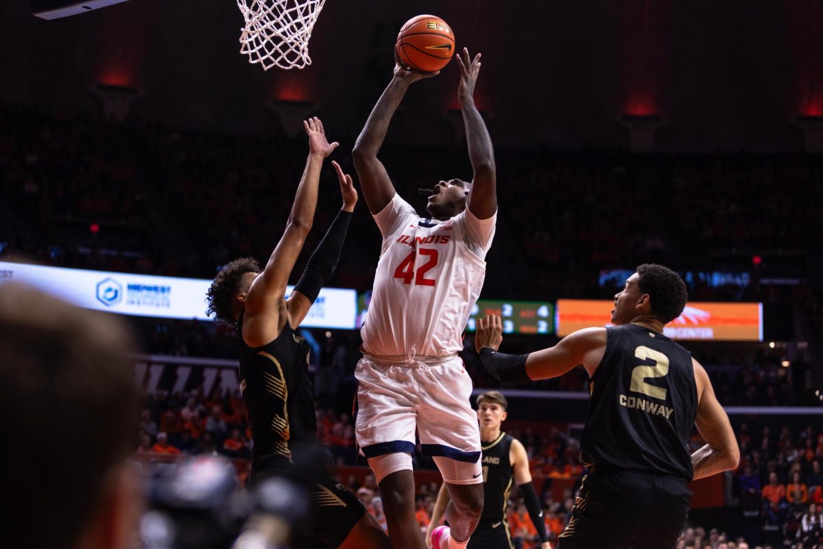Forward/center Dain Dainja cuts through Oaklands defense to make a layup during the second half. The game ended in a 64-53 victory for Illinois.