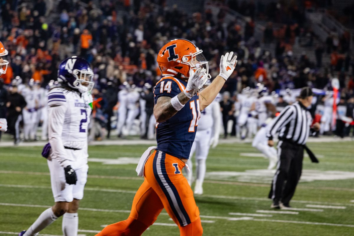 Senior+wide+receiver+Casey+Washington+celebrates+an+80-yard+touchdown+pass+in+the+closing+minutes+of+the+game+against+Northwestern.+Despite+Washingtons+remarkable+play%2C+Illinois+lost+43-45