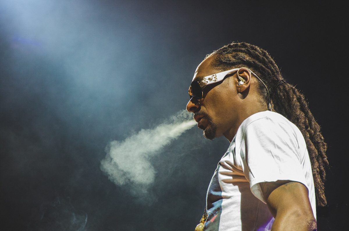 Snoop Dogg blows smoke while performing at The High Road Summer Tour 2016 at the Molson Canadian Amphitheatre. Photo Courtesy of Charito Yap/Wikimedia Commons.
