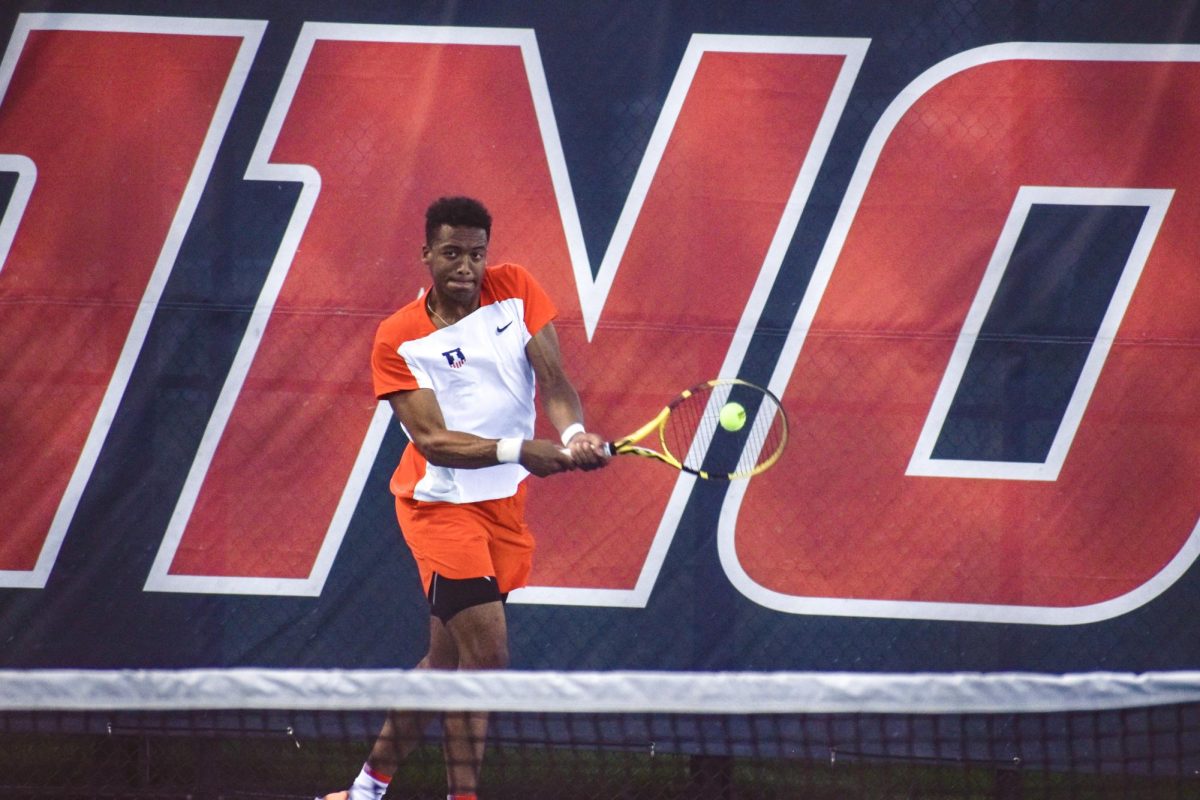 Oliver Okonkwo plays against Wisconsin in tennis singles on Apr. 14.