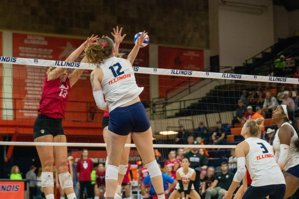 Senior outside hitter Raina Terry hits the ball cross court against Indiana on Oct. 25. Terry tallies 539 kills with 4.69 per set as well as strikes 36 aces.