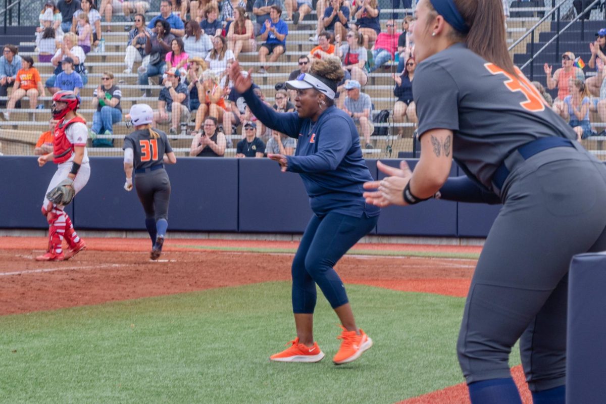 Head coach Tyra Perry yells from the field as Illinois faces off against Ohio on Apr. 15.