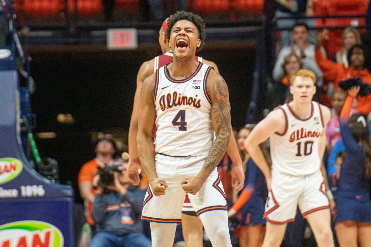 Fifth year guard Justin Harmon celebrates a successful 3-pointer for Illinois against Indiana on Saturday.