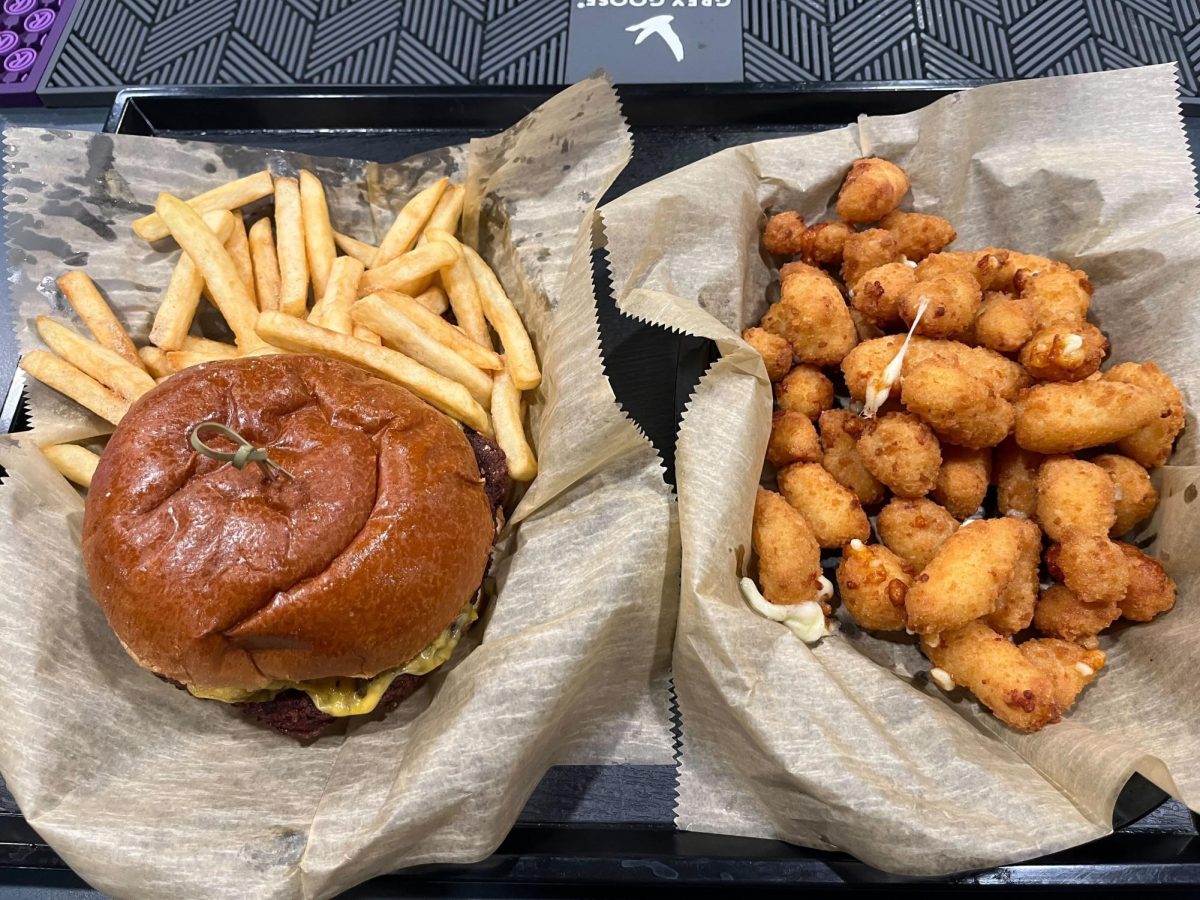 The Park Bar & Grills pub burger served with a side of fries and a basket of cheese bites