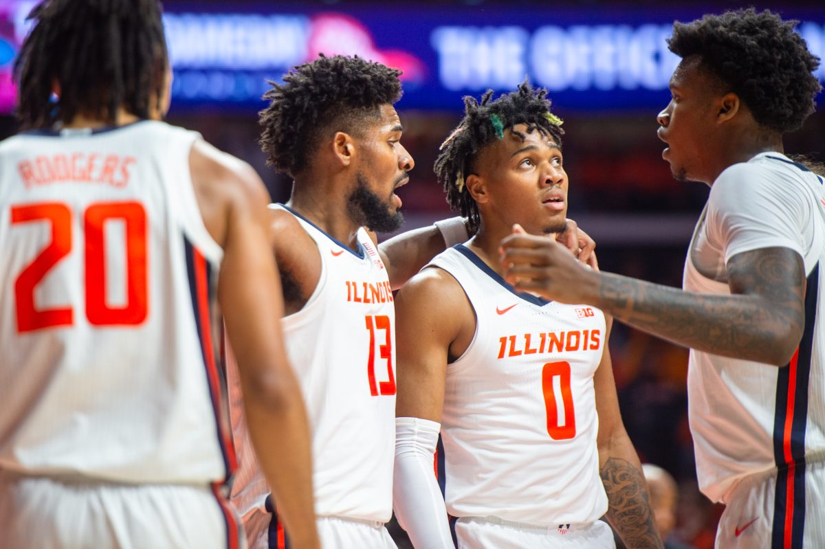 Fifth-Year+Guard+Terrence+Shannon+Jr.+and+Graduate+Student+Quincy+Guerrier+celebrate+a+defensive+rebound+in+the+exhibition+against+Kansas+on+Oct.+29.
