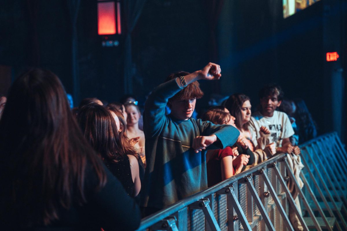 Enthusiastic audience members enjoy a Taylor Swift tune at Canopy Club on Friday.