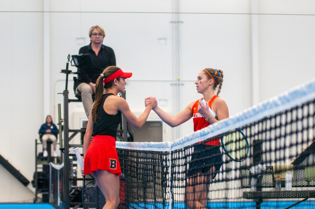 Junior Kasia Treiber shakes hands with her Brown University opponent after winning her match on Saturday.