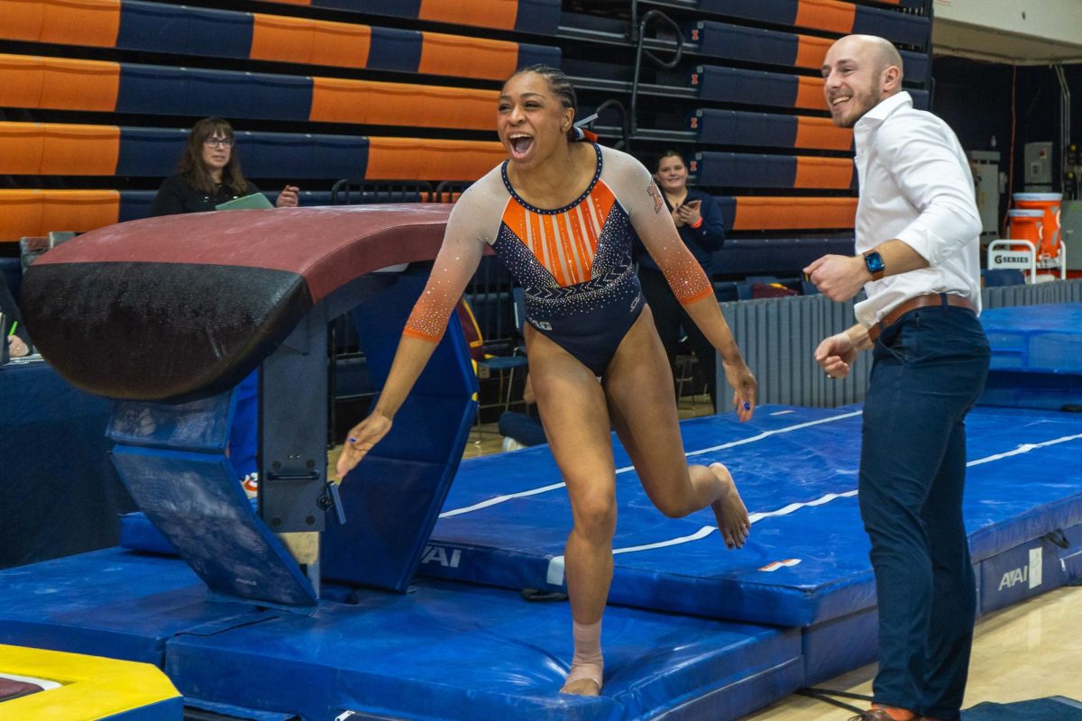 Junior Makayla Green extatics after completes a successful vault during the meet against Minnesota on Feb. 18. 