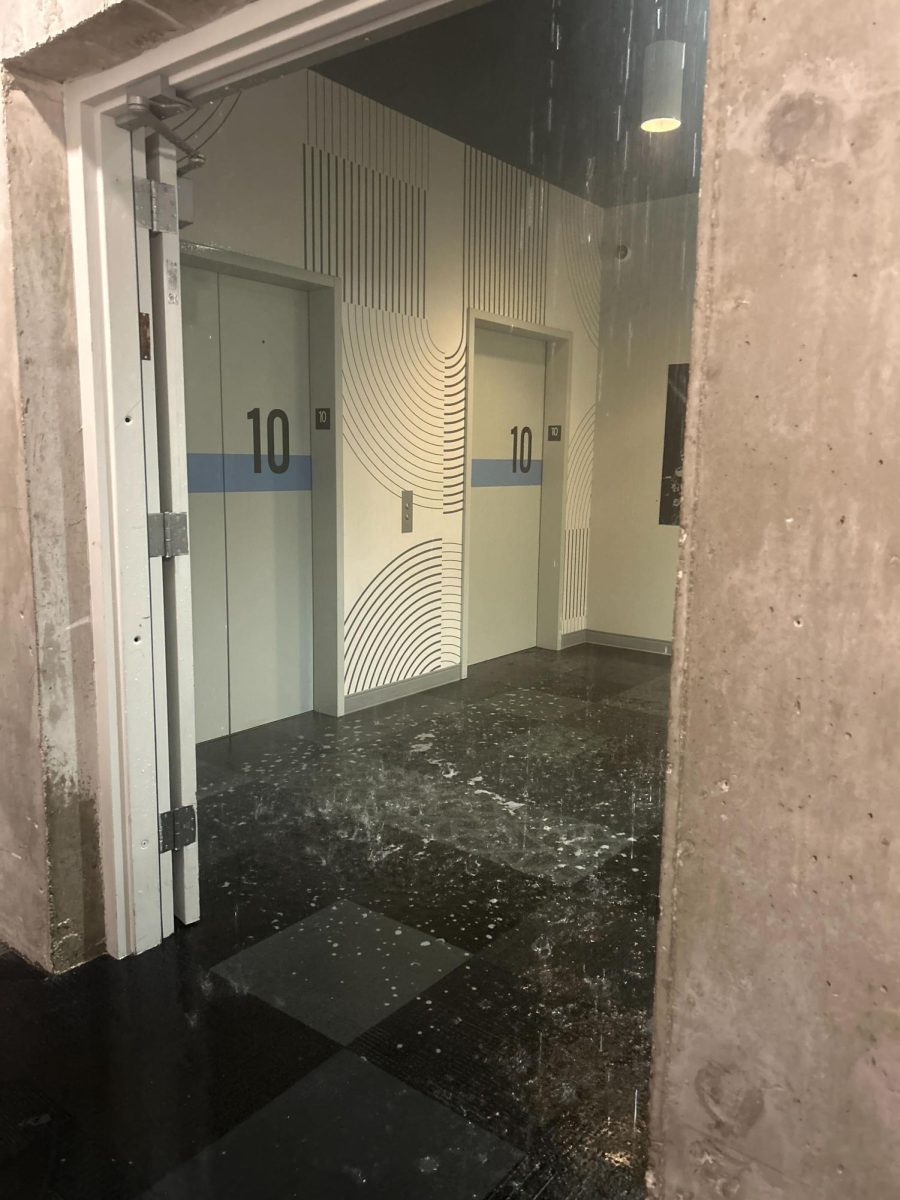 The elevator bay on the 10th floor of HERE Champaign experienced heavy flooding after a supposed sprinkler issue on Tuesday.