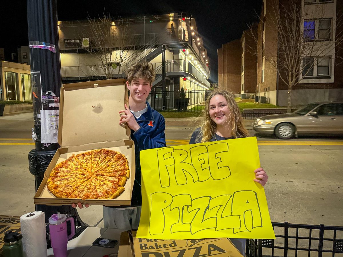 ISC presidential ticket Carter Cohen and Viktoriya Dragnevska hand out pizza outside of KAMS’ “KAMRock” pop-up on Tuesday evening.