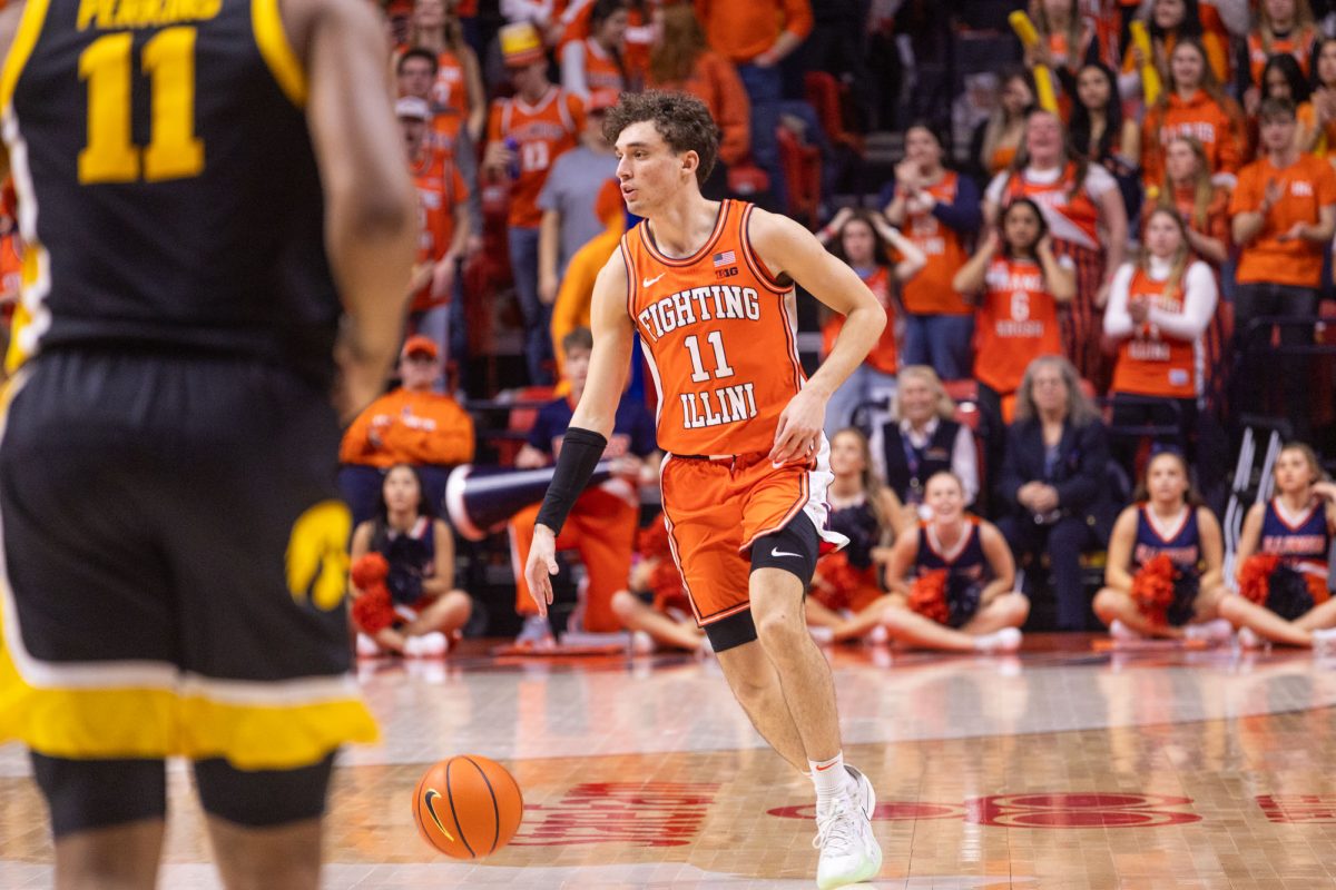 Redshirt freshman guard Niccolo Moretti dribbles towards the Iowa side of the court during the second half.