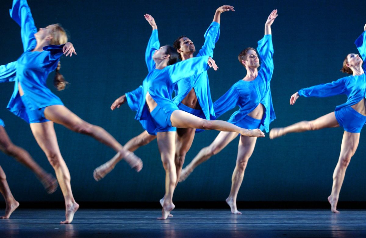 Performers of the Mark Morris Dance Group cover the stage in blue with their apparel. The dance group performed at the Krannert Center for the Performing Arts stage on Friday night.