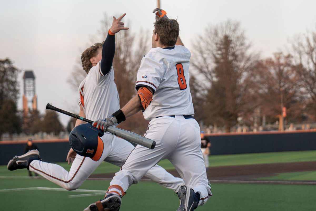 Grad+student+Jacob+Schroeder+and+junior+Camden+Janik+celebrate+Jacob%E2%80%99s+home+run+at+the+end+of+the+game+against+Eastern+Illinois+on+Feb.+28.+