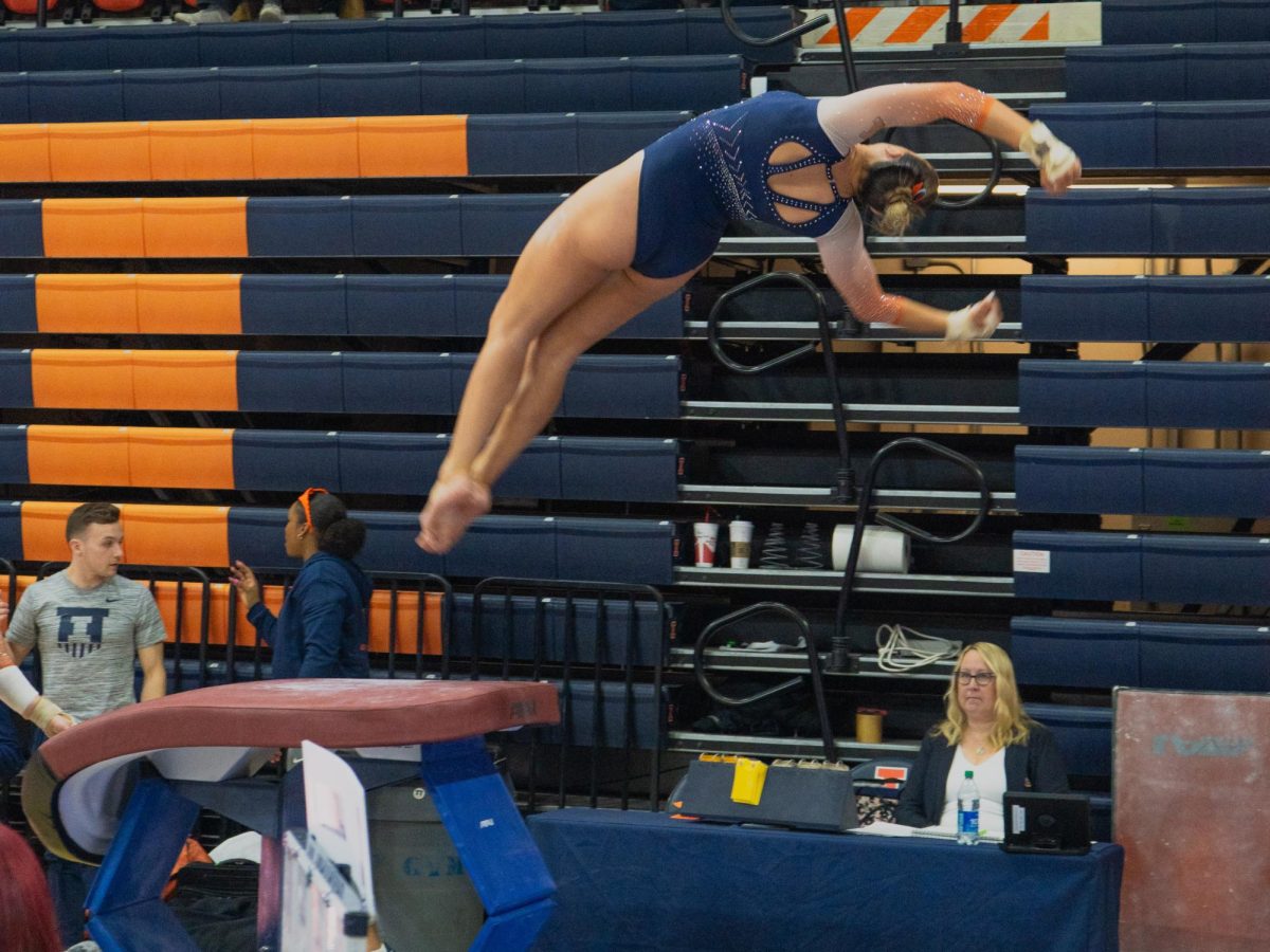 An+Illini+Gymnast+flips+over+the+vault+during+the+meet+with+Minnesota+on+Feb.+18.+
