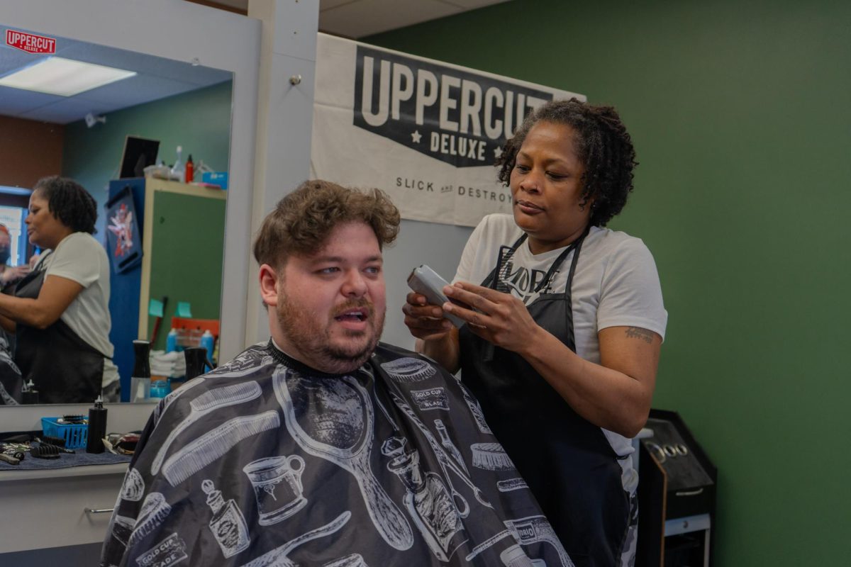 James Steur, a graduate student studying political science, gets his haircut at the Urbana Campus Barber Shop on South Lincoln Avenue and West Nevada Street on Feb. 28.