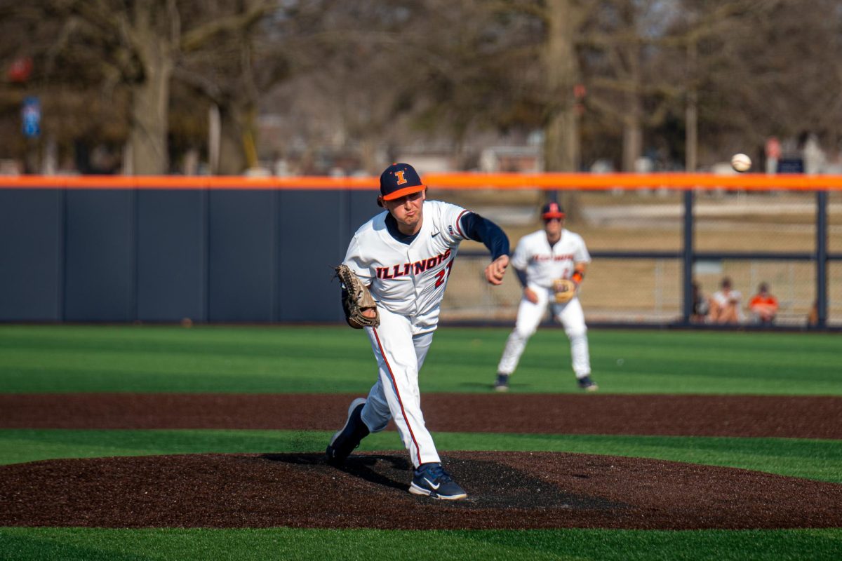 Graduate student Cooper Omans throws out the first pitch at the home opening game against Eastern Illinois on Feb. 28.