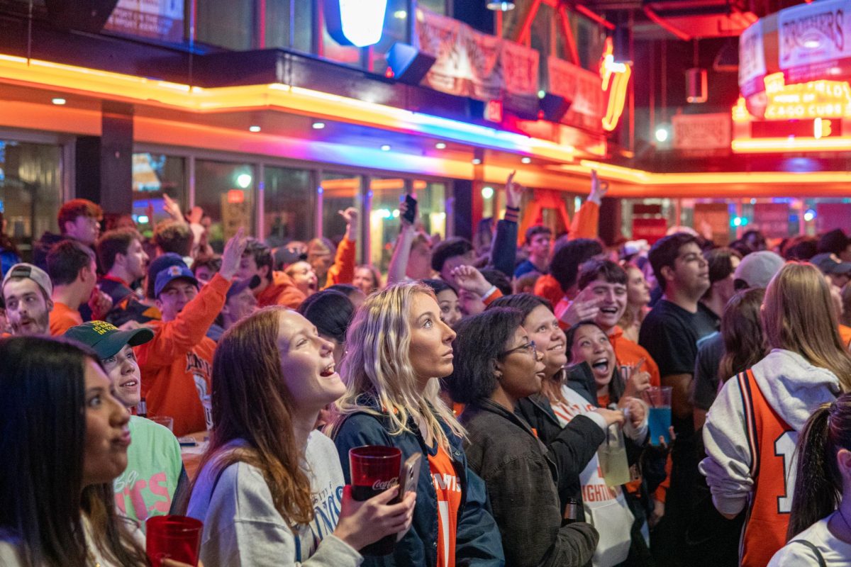 University students gather at Brothers Bar & Grill at 601 S. First St. to support the men’s basketball team during a March Madness basketball game.