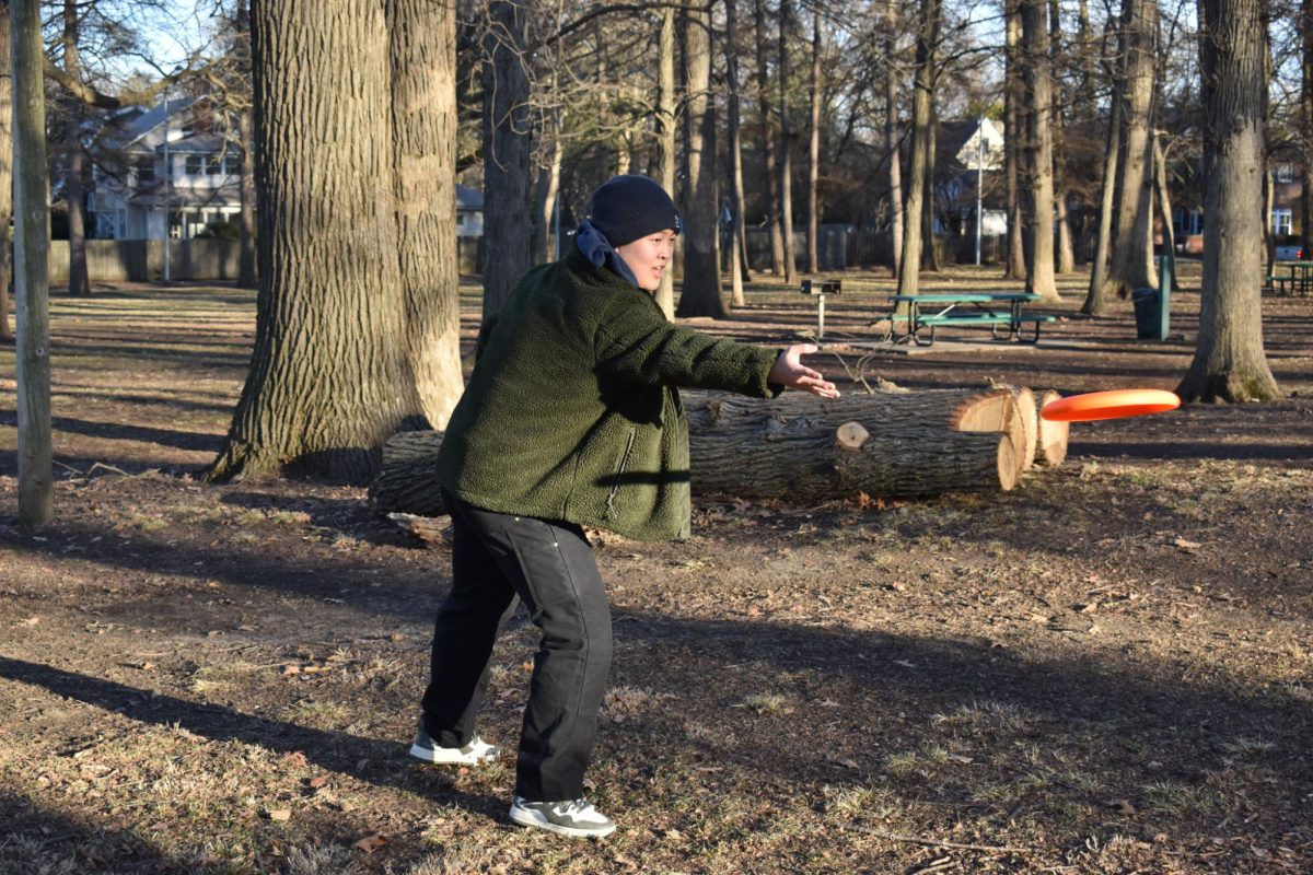 Michael Sun, sophomore LAS, plays frisbee at Illini Grove on March 1.