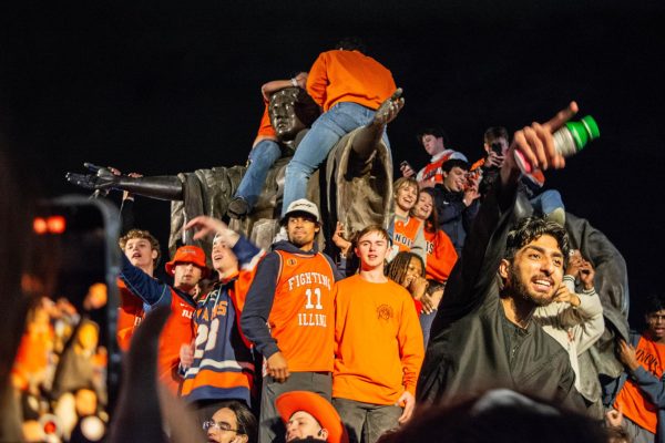 Students swarm Alma Mater after Illinois wins against Iowa State, making it to the Elite 8 on March 28.