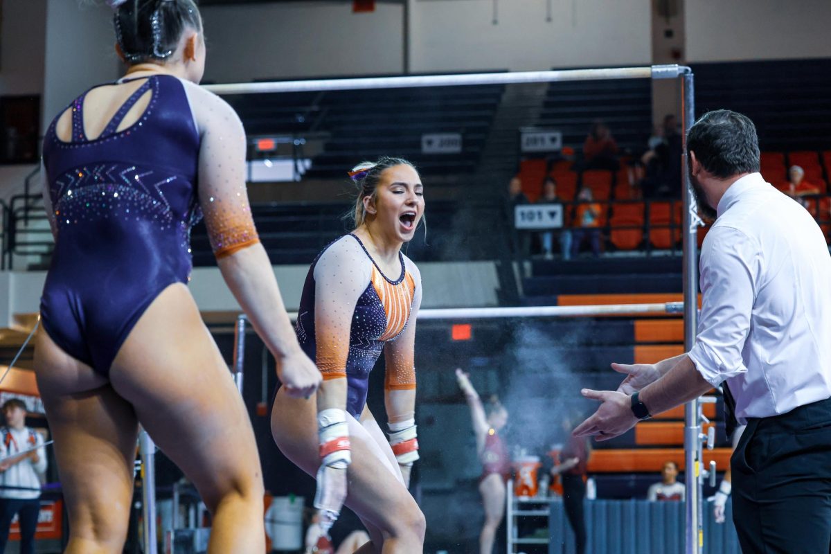 Amelia Knight celebrates her uneven bars routine against Minnesota on Feb. 18.