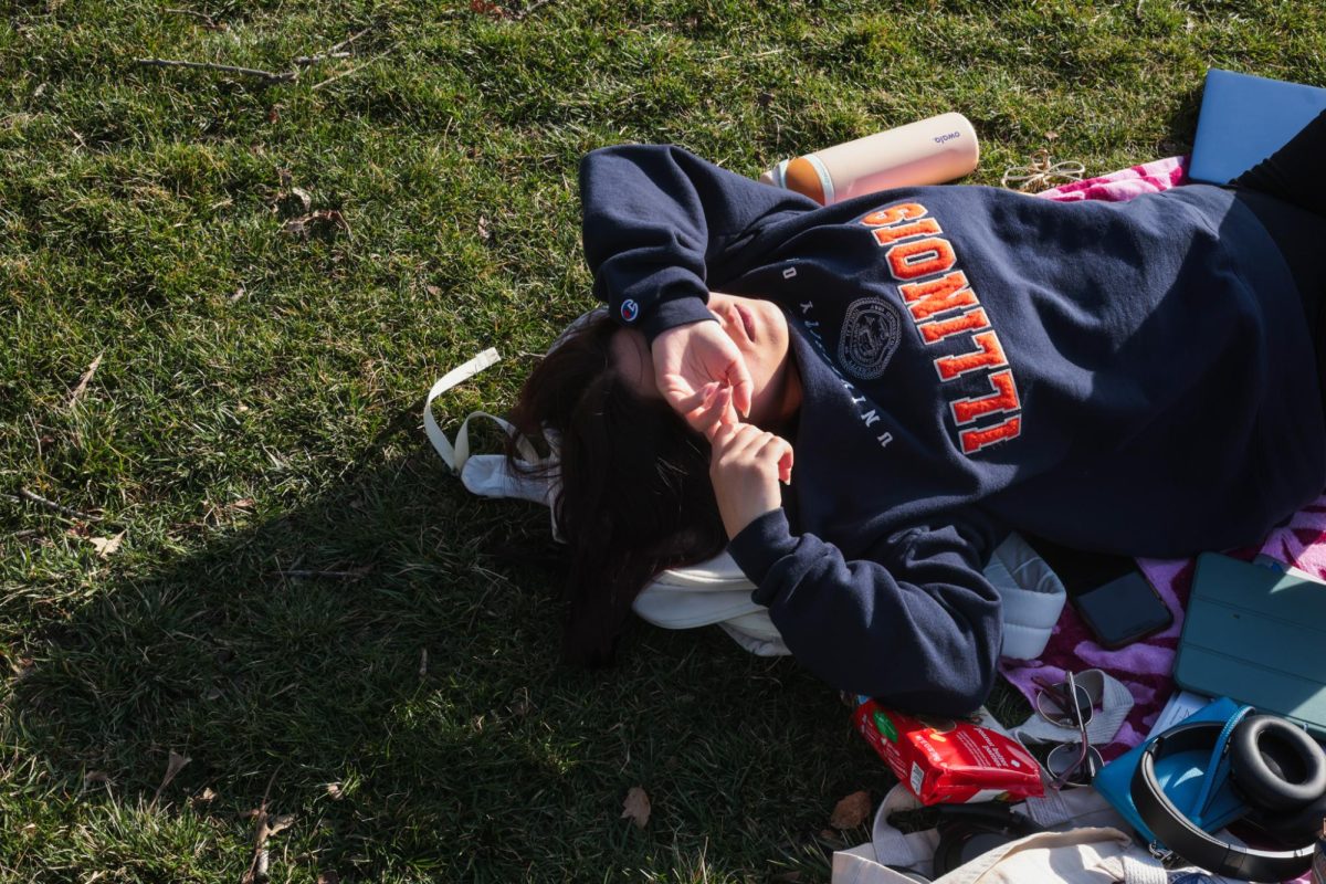 A University student takes a nap on the Main Quad on March 2.