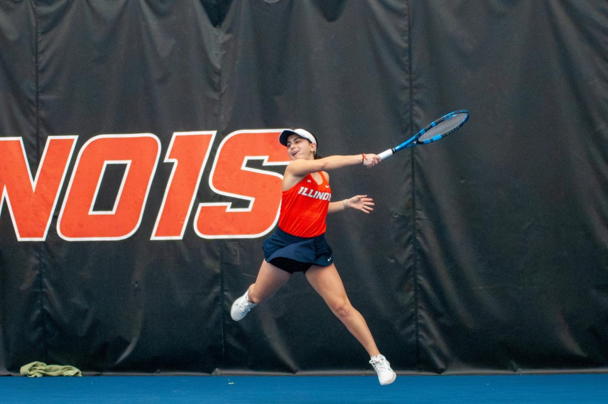 Sophomore Violeta Martinez returns the ball in her match on Feb. 17, which was cut short because the Illini won the meet automatically.