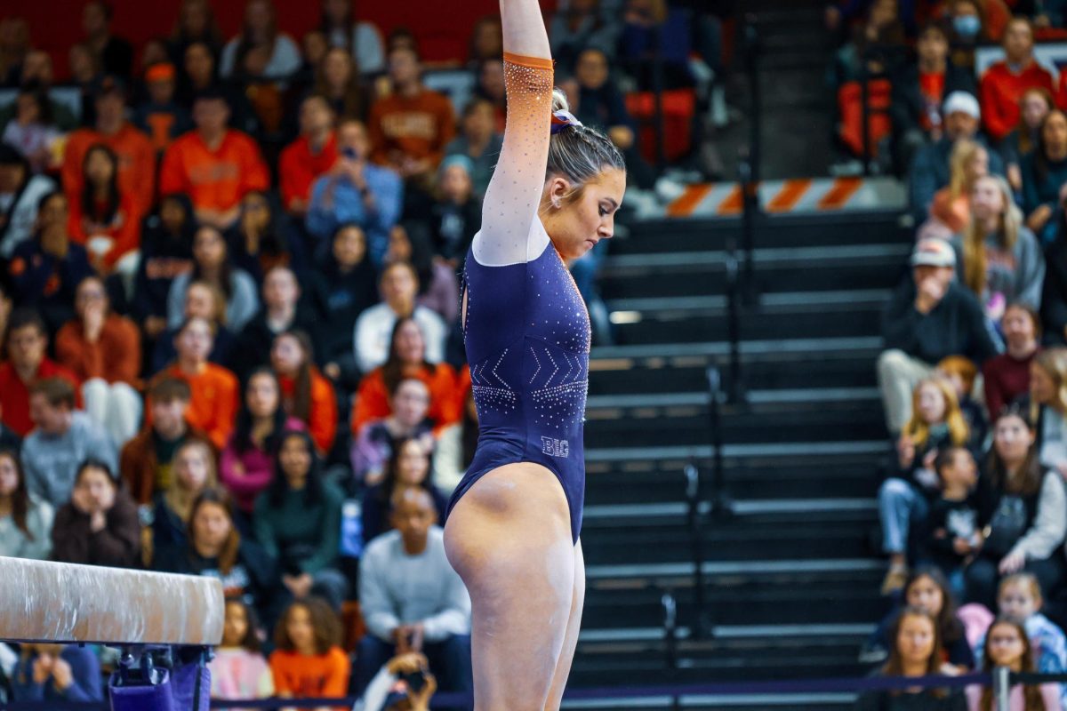 Illinois Senior Amelia Knight prepares before competing on the beam in a gymnastics meet on Feb. 18.
