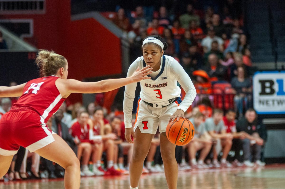Senior Guard Makira Cook holds the ball at the top of the key against Nebraska on March 3. Cook led the Illini with 20 points on 8-13 on Monday’s win over Washington State.