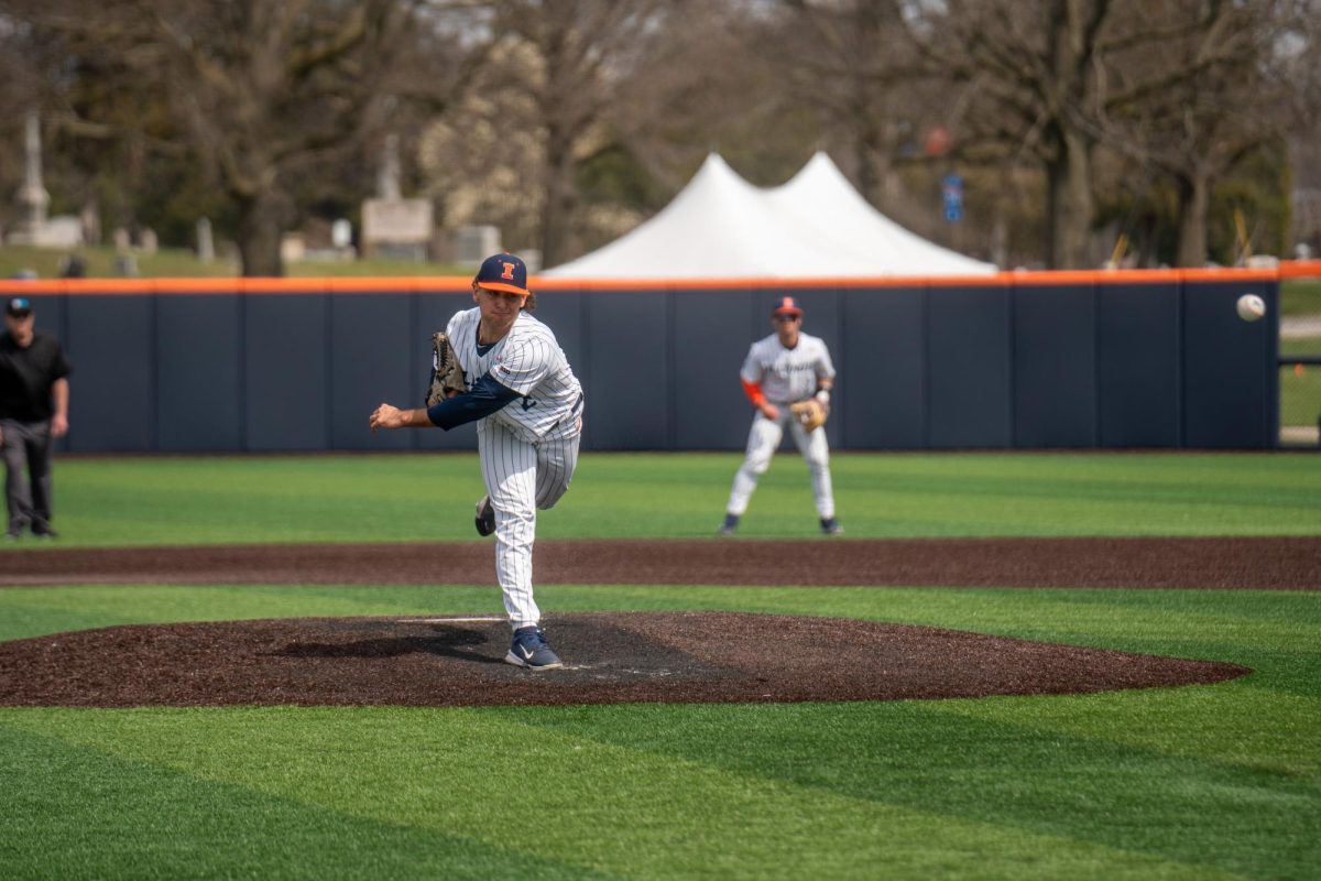 Graduate pitcher Cooper Omans pitches for the Illini on March 27 in their first game of the double header.