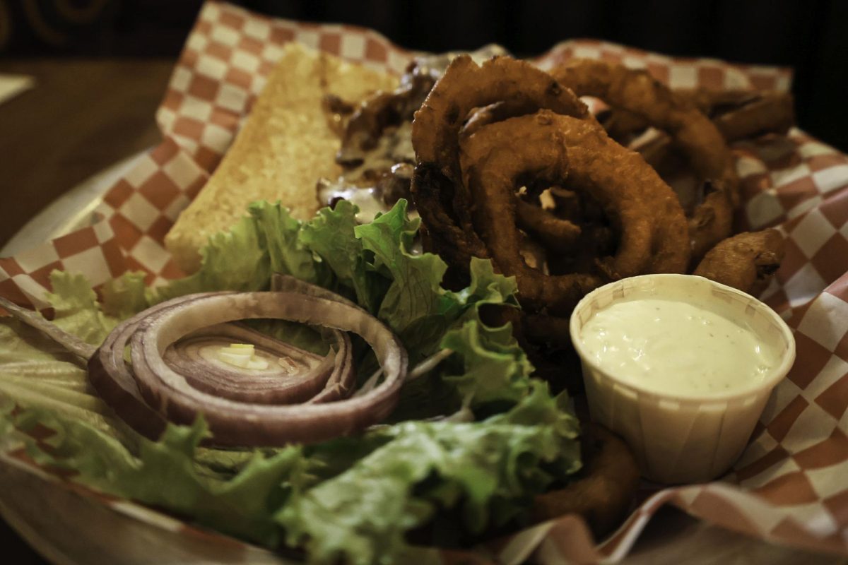 A BBQ Chicken Bacon sandwich with onion rings from Farrens Pub and Eatery.