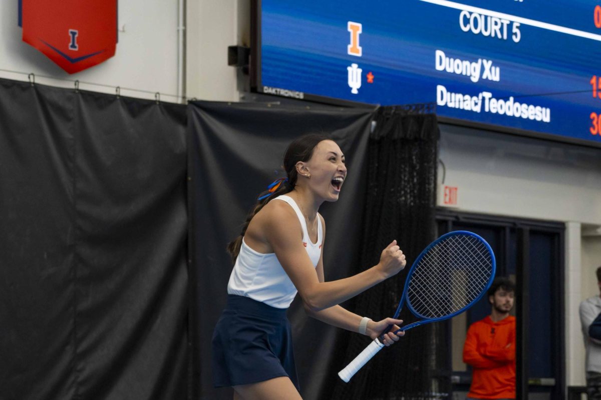 Junior Kida Ferrari exclaims in celebration after winning a point during the Illinois vs. Indiana match on Friday, April 12 in the Atkins Tennis Center on South Goodwin Avenue.
