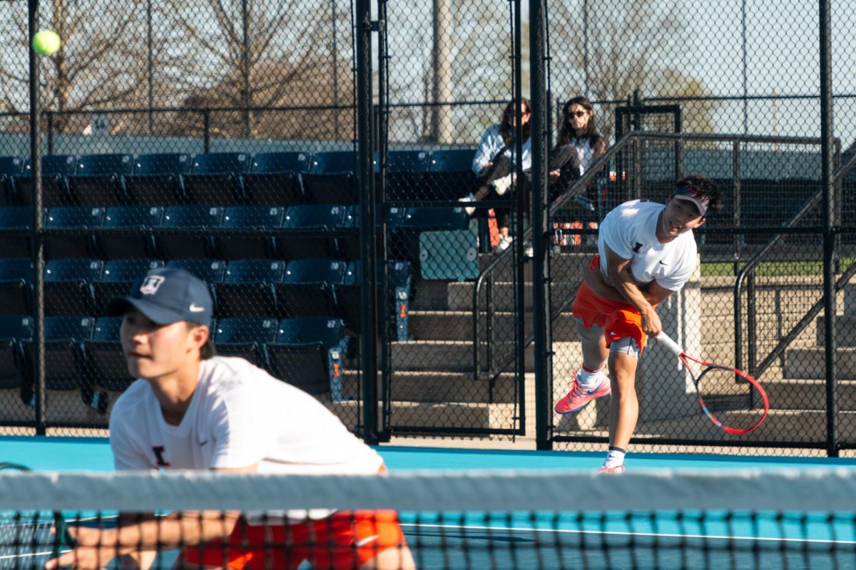 Freshman Jeremy Zhang serving during the doubles match. Senior Hunter Heck and Zhang played Sophomore Andres Castellanos and Sophomore Luca Lo Nardo resulting in an unfinished match.