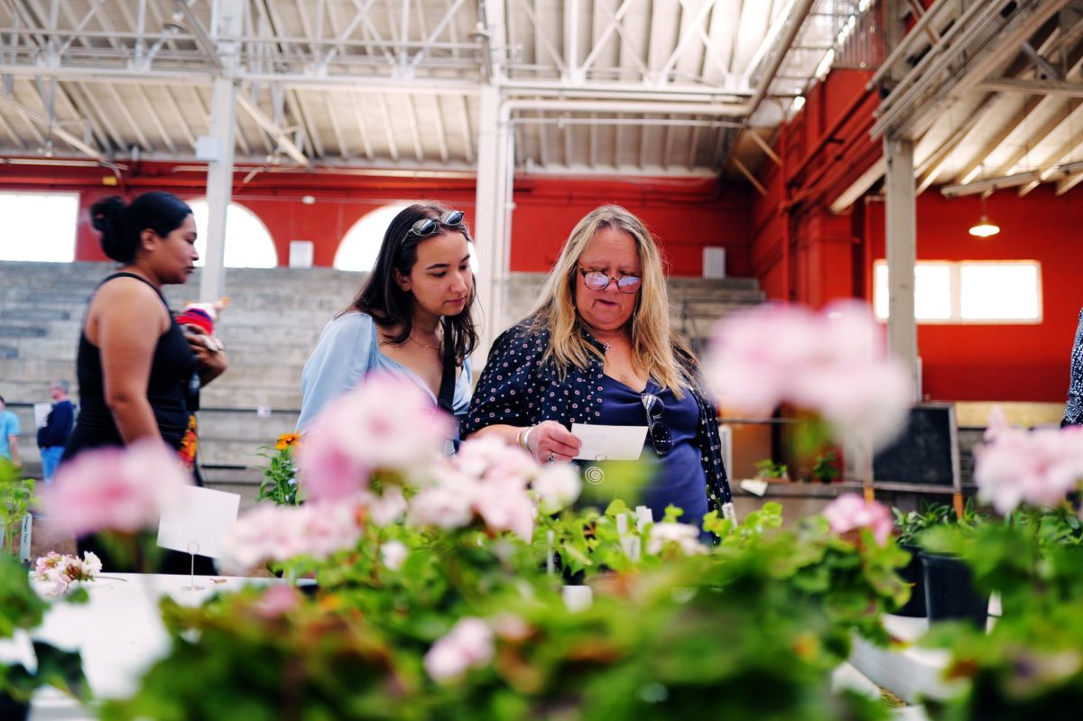 A mother and daughter explore the plants at the plant fair, which took place during the University’s Moms Weekend.