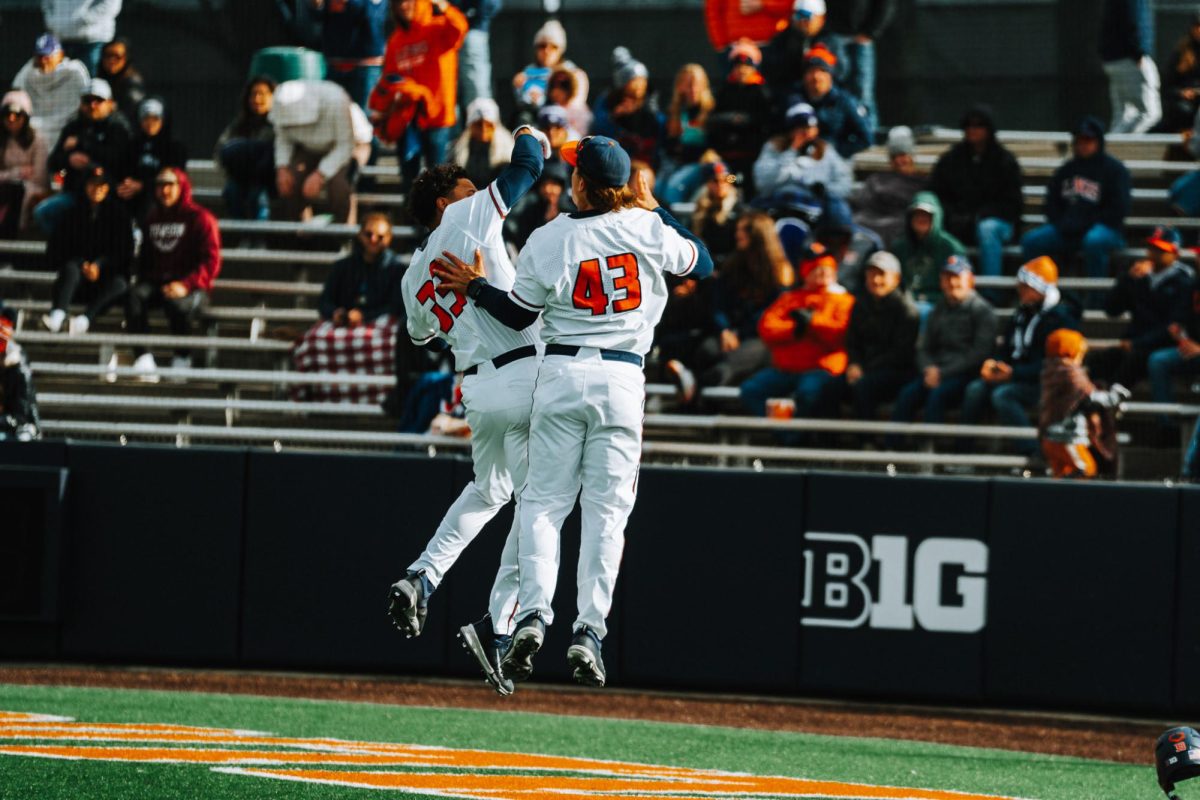 Senior hitter Connor Milton celebrates with his teammate after hitting a home run against Northwestern on Saturday.
