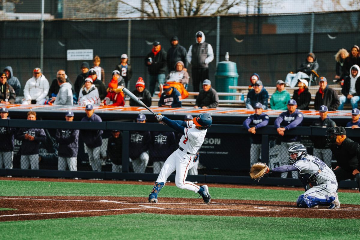 Senior shortstop Brody Harding swings at the 2-1 pitch in the bottom of the fifth inning against Northwestern on April 20.