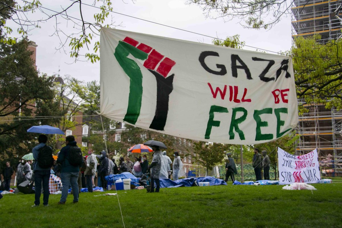 A banner with Gaza will be free written on it hangs at the north side of the encampment during the day on Friday.