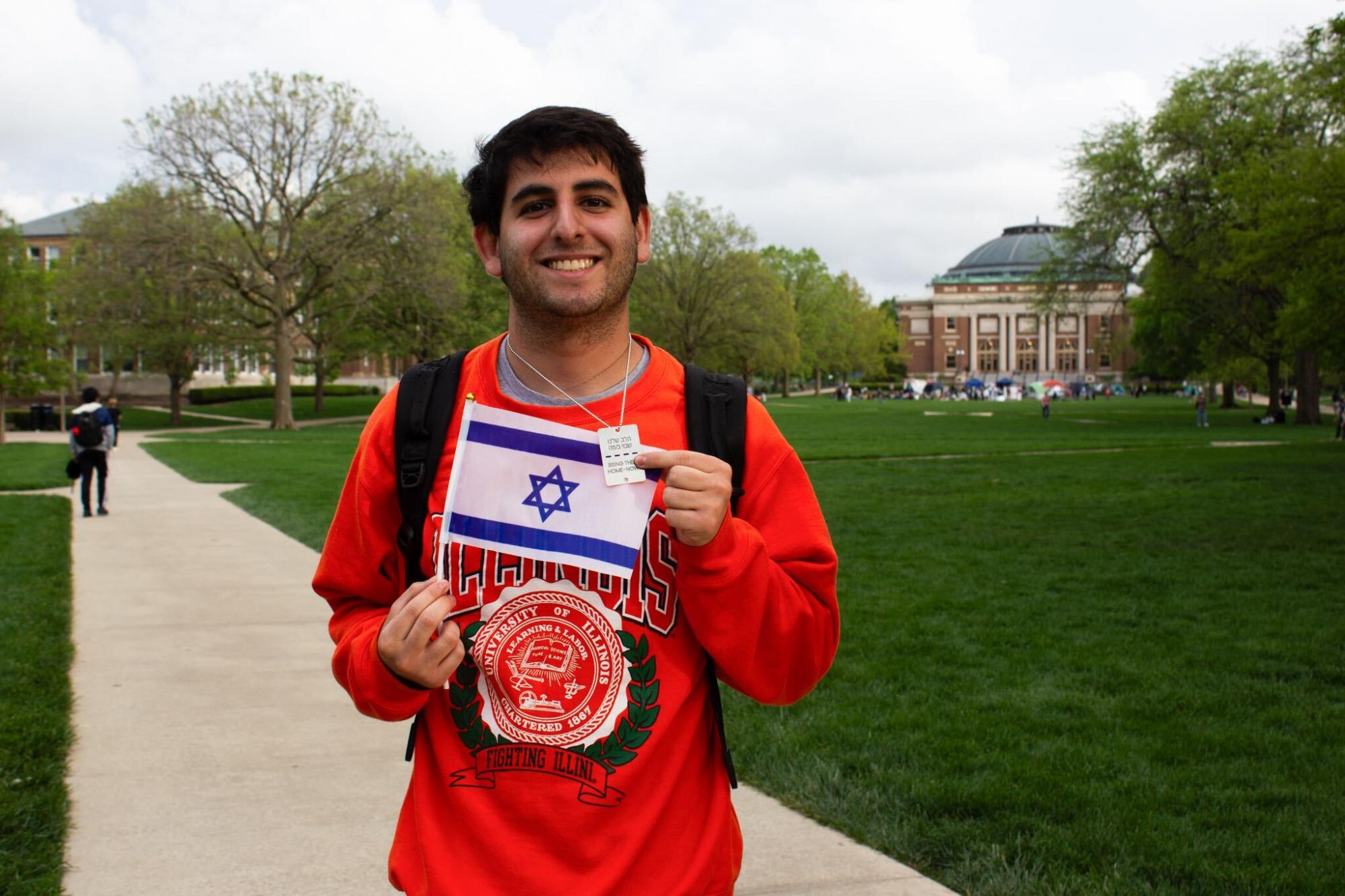 Ethan Morady, junior in Gies, holding an Israeli flag.
