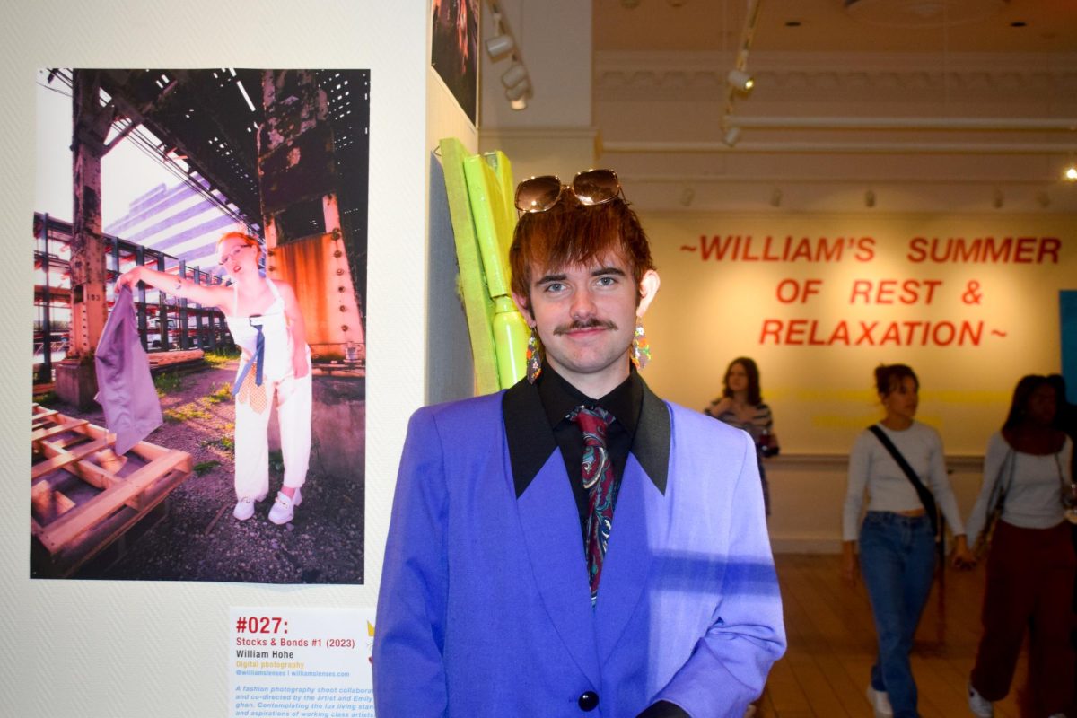 William Hohe, a junior in Media, at their solo art exhibition “William’s Summer of Rest & Relaxation” in the Illini Union’s Art Gallery, 2023.
