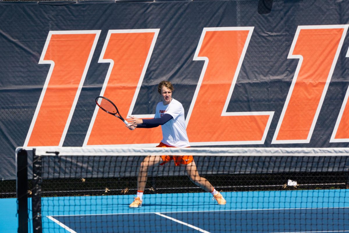 Karlis Ozolins prepares to return a serve from Ohio State during a doubles match on March 26.