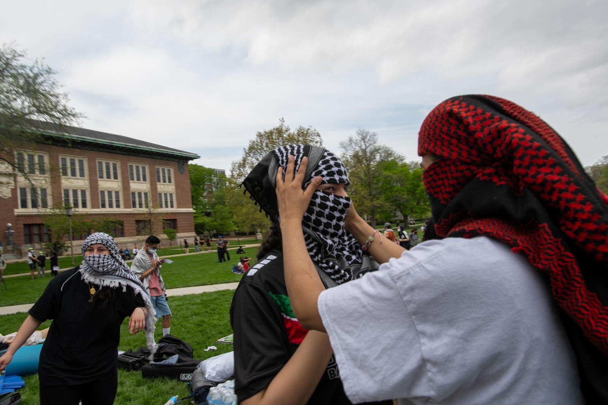 Protesters put on Keffiyeh to block their faces during the demonstration.