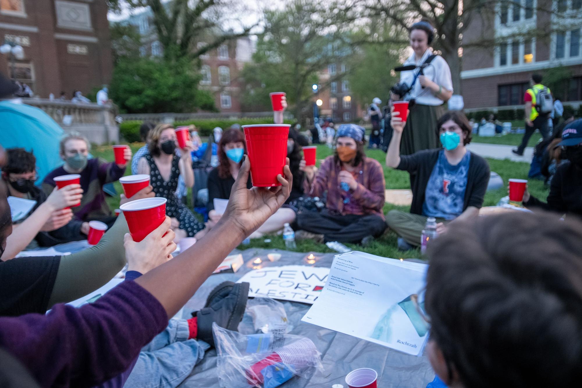 Jewish protesters hold a passover seder in the middle of the encampment zone on the Main Quad.