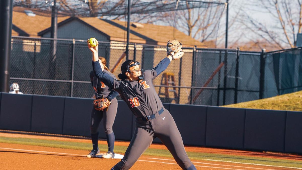#30 Lauren Wiles pitches in a game against SIUE on March 27. Illinois would win the game 19-9 after 6 innings.