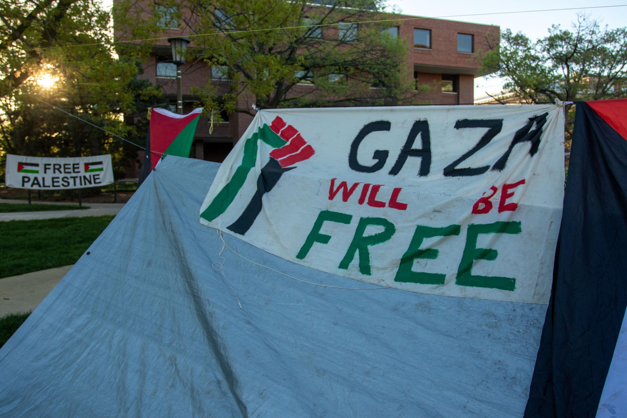 A tent at the Palestine encampment in the Main Quad stands as the sun rises on Tuesday morning.