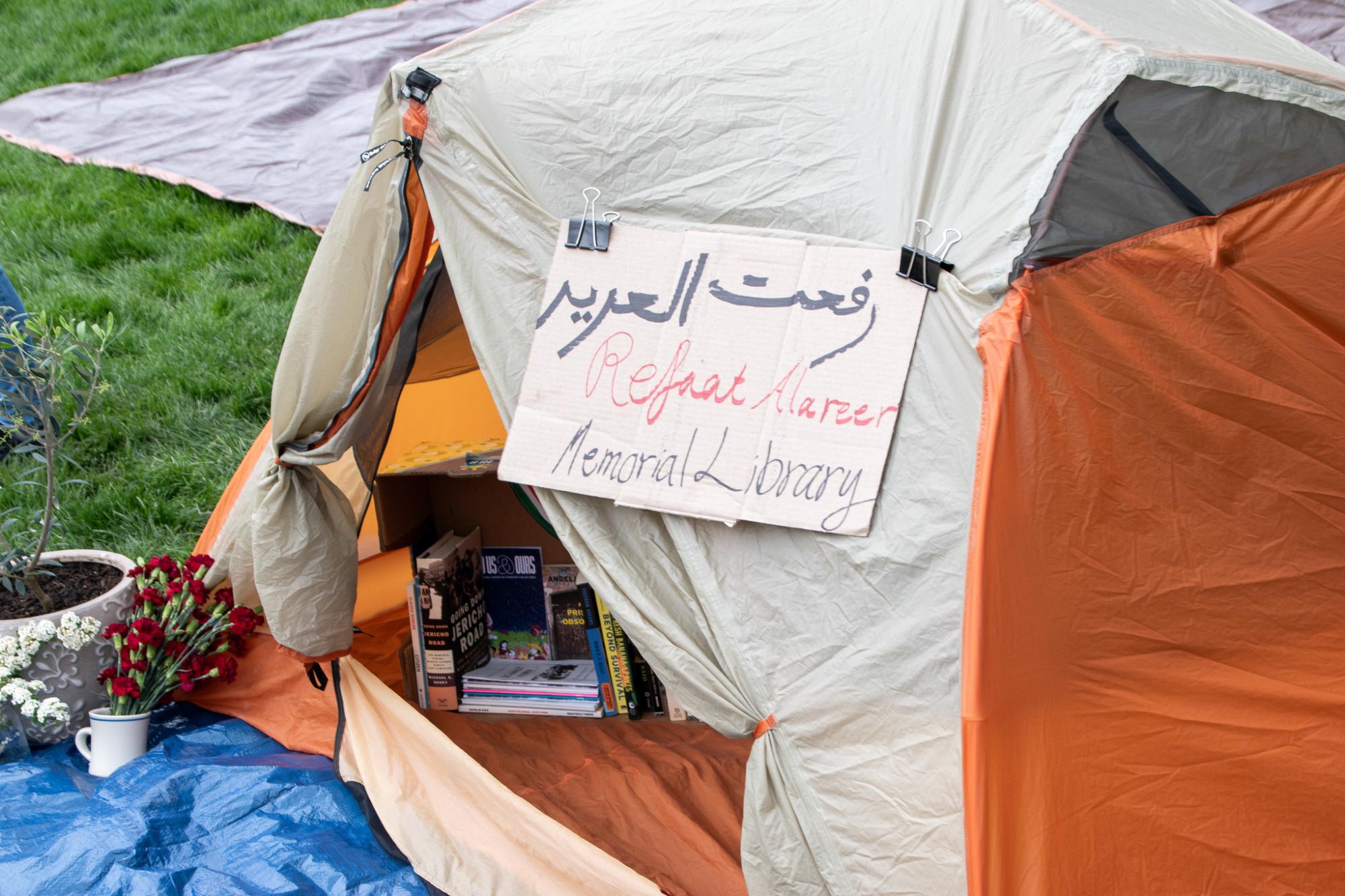 Demonstrators turn a tent into their “Memorial Library.” They stocked the tent with books as well as educational pamphlets for other demonstrators to read.