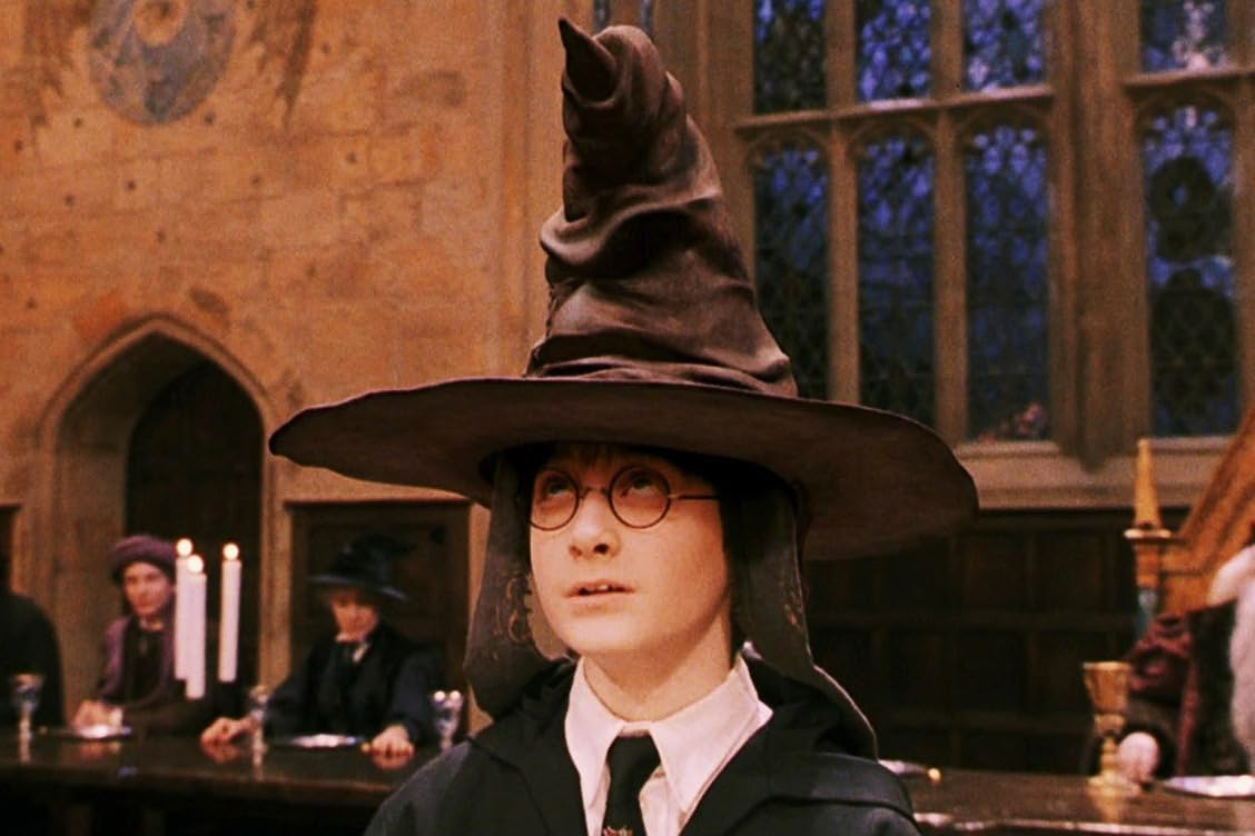 Harry Potter wears the Sorting Hat in the first movie of the series, “Harry Potter and the Sorcerer’s Stone.”